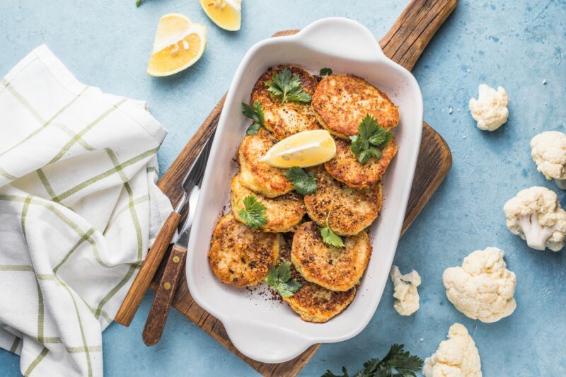 Vegan cauliflower vegetable fritters on the kitchen tVegan cauliflower vegetable fritters on the kit