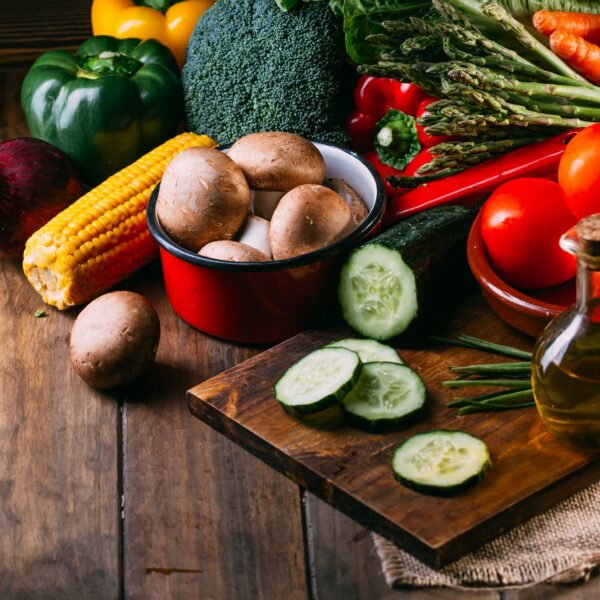 Vegetables and utensils on kitchen table