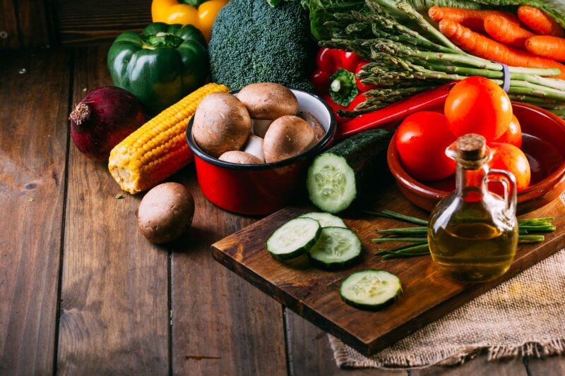 Vegetables and utensils on kitchen table